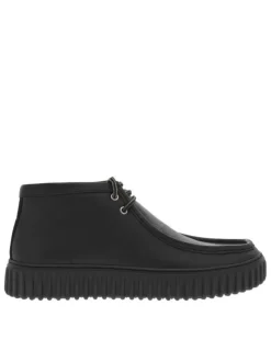 Bottines en cuir noires à semelle striée plates et à lacets ronds tressés