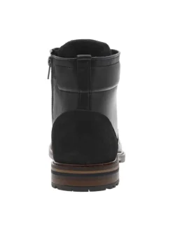 Bottines en cuir noires à talon plat avec un zip et des lacets ronds