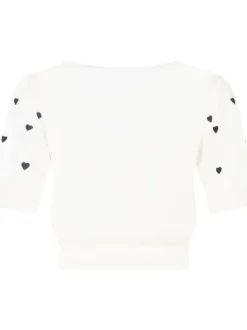 Cardigan blanc avec des cœurs imprimés et une coupe droite à col v