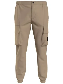 Cargo beige uni avec une coupe skinny fit et un lien de serrage à la taille
