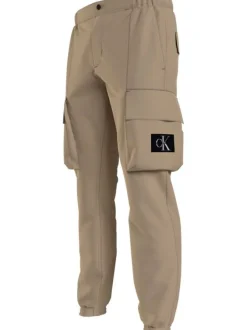 Cargo beige uni avec une coupe skinny fit et un lien de serrage à la taille