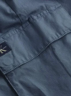 Cargo en coton bleu uni à coupe skinny avec une taille et des ourlets élastiqués