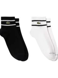 Chaussettes basses en coton mélangé noires et blanches rayées avec logo vert