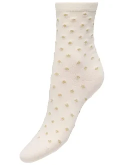 Chaussettes hautes beiges à pois dorés sur le pourtour