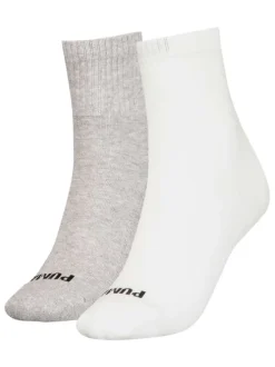 Chaussettes hautes blanches avec un coeur brodé à l'arrière en noir