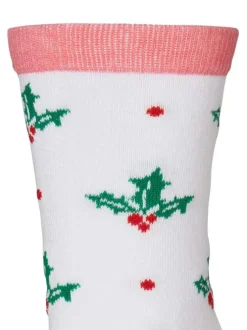 Chaussettes hautes blanches, vertes et rouges avec un imprimé houx
