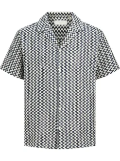 Chemise blanche et marine en crochet pourvue d'un col cubain