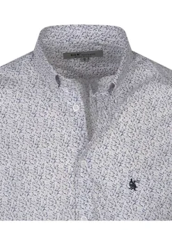 Chemise blanche à pois rouges avec un col américain et des manches courtes