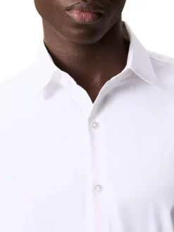 Chemise blanche unie à coupe slim et à manches longues boutonnées