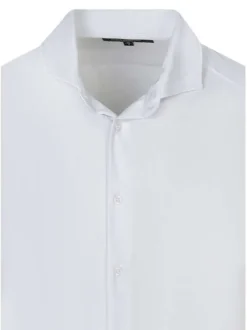 Chemise blanche unie pourvue d'une coupe droite et des manches longues
