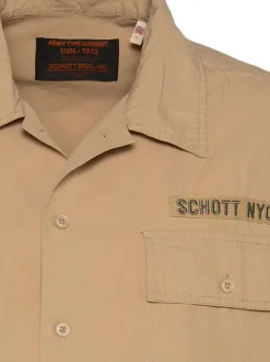 Chemise en coton beige à coupe droite pourvue d'un col à revers