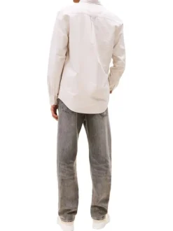 Chemise en coton beige unie avec des boutons et une coupe droite