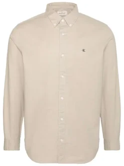 Chemise en coton beige unie avec une coupe droite et un col à revers