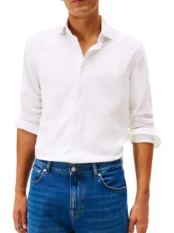 Chemise en coton blanche à coupe droite pourvue d'un col à revers
