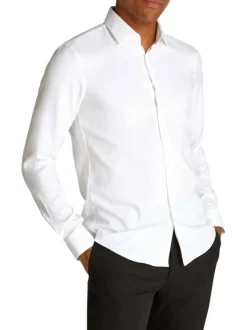 Chemise en coton blanche unie avec une coupe ajustée et les boutons cachés