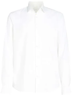 Chemise en coton blanche unie avec une coupe ajustée et les boutons cachés