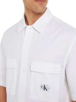 Chemise en coton blanche unie avec une coupe relaxed et un col français
