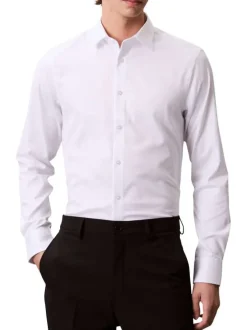 Chemise en coton blanche unie à coupe slim avec des manches boutonnées