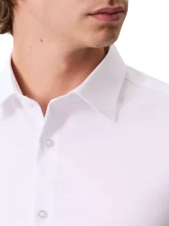 Chemise en coton blanche unie à coupe slim avec des manches boutonnées