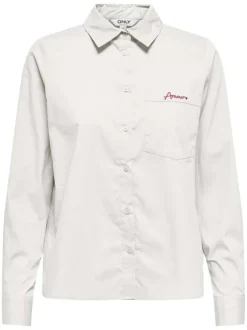 Chemise en coton blanc unie avec une coupe droite et une petite poche