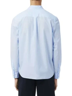 Chemise en coton bleu clair à coupe droite pourvue d'un col à revers