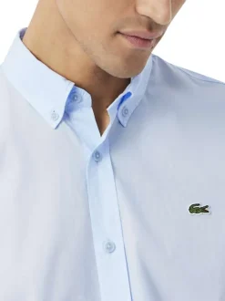 Chemise en coton bleu clair à coupe droite pourvue d'un col à revers