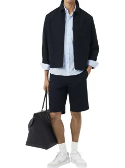 Chemise en coton bleu clair à coupe droite pourvue d'un col à revers