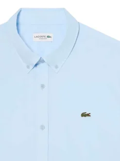 Chemise en coton bleu clair à coupe droite pourvue d'un col à revers