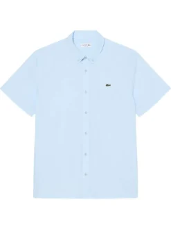 Chemise en coton bleu clair à coupe droite pourvue d'un col à revers