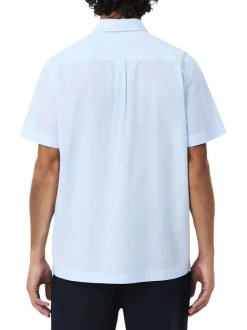 Chemise en coton bleu clair à coupe droite pourvue d'un col à revers