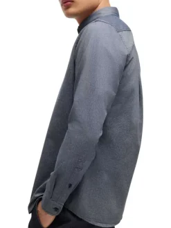 Chemise en coton bleue marine avec une coupe ajustée et des manches longues
