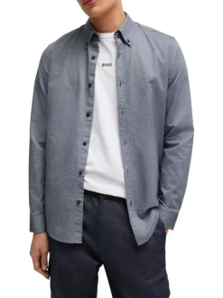 Chemise en coton bleue marine avec une coupe ajustée et des manches longues