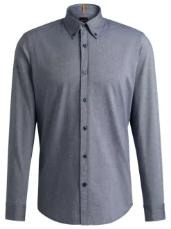 Chemise en coton bleue marine avec une coupe ajustée et des manches longues
