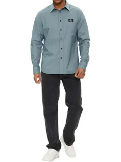 Chemise en coton bleue unie à coupe slim fit et à manches longues boutonnées