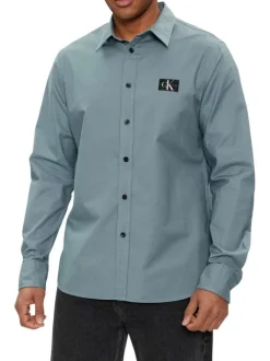 Chemise en coton bleue unie à coupe slim fit et à manches longues boutonnées