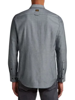 Chemise en coton grise unie avec une coupe droite et des boutons