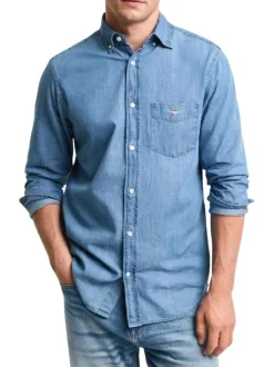 Chemise en coton indigo unie avec une coupe droite et un col boutonné