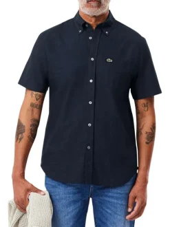 Chemise en coton marine unie avec une coupe droite et un col français