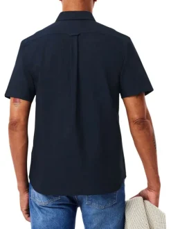 Chemise en coton marine unie avec une coupe droite et un col français