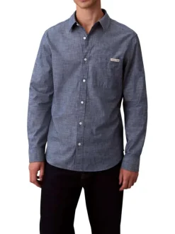 Chemise en coton marine unie avec une coupe droite et un col à revers
