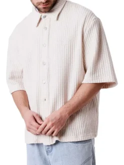 Chemise en coton mélangé écrue unie pourvue d'un col chemise
