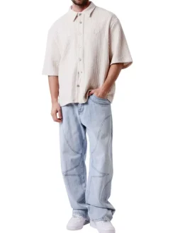 Chemise en coton mélangé écrue unie pourvue d'un col chemise