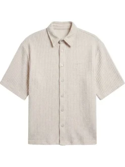 Chemise en coton mélangé écrue unie pourvue d'un col chemise