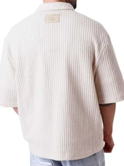 Chemise en coton mélangé écrue unie pourvue d'un col chemise