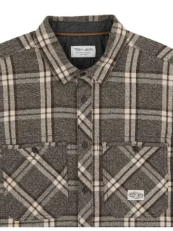Chemise en coton noire à carreaux avec une coupe droite et un col français