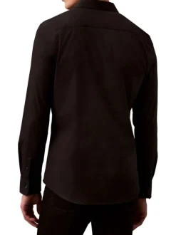 Chemise en coton noire unie à coupe regular fit fermée par des boutons