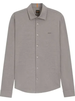 Chemise en coton verte unie avec boutonnière nacrée et logo brodé