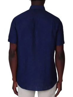 Chemise en lin indigo unie avec une coupe droite et un col boutonné