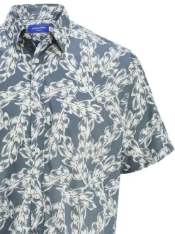 Chemise manches courtes bleue en coton à imprimé floral avec une coupe ample