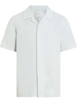Chemise à manches courtes en lin blanche unie avec un col cubain